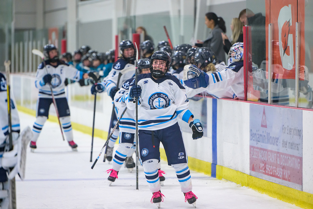 Players skating down ice