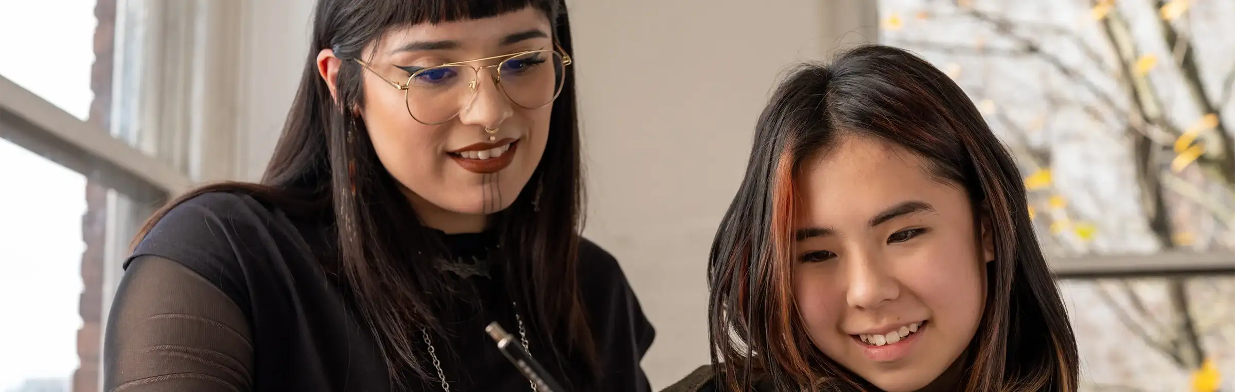 Photo of someone helping a student.