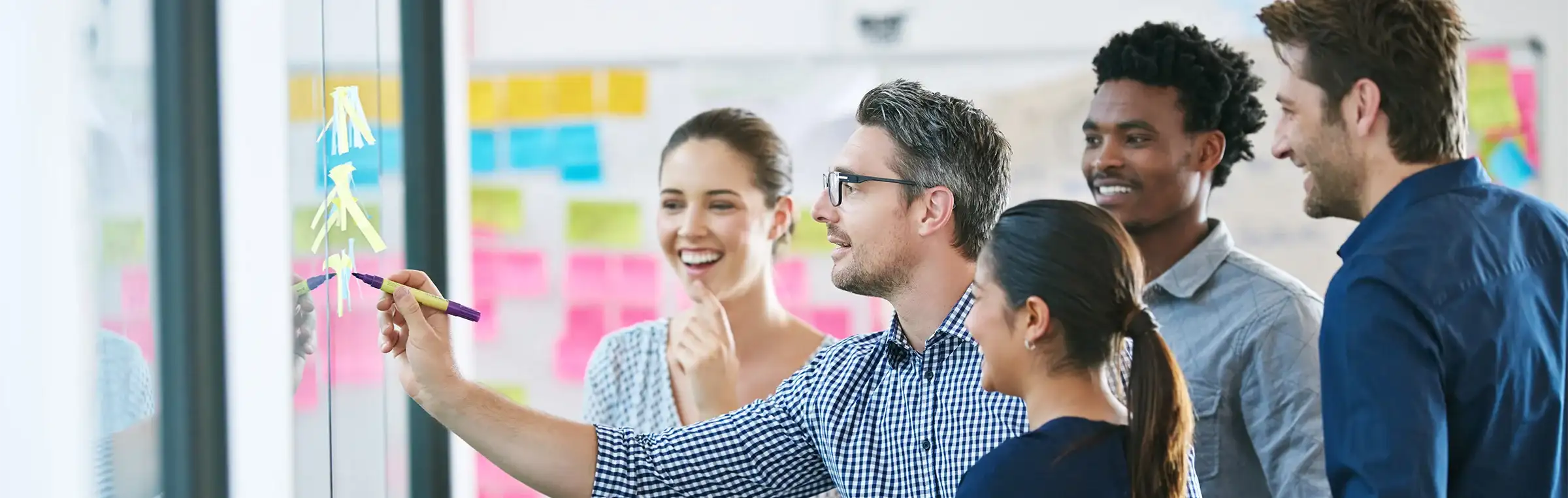 Photo of someone engaging and leading a diverse group.